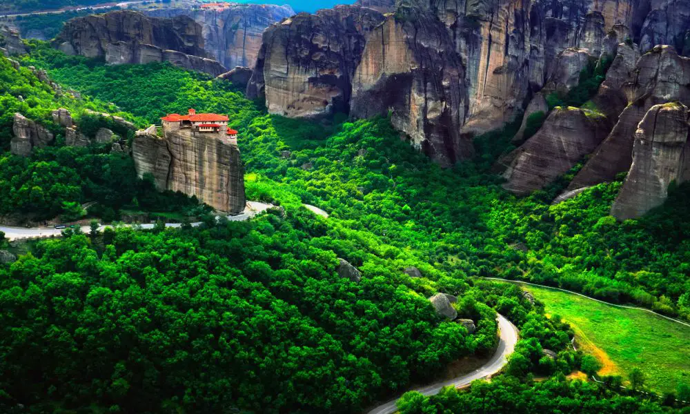 7. Hiking the Meteora Monasteries
One of the best things to do at Meteora Monasteries is to hike between the different monasteries along well-marked paths. In addition, you get to spend some time away from the crowd of more typical visitors and enjoy a quieter monastic life. Hiking between the monasteries takes more than half a day, and it is advisable to start early in the morning.
I recommend that you visit three or four monasteries on the same hike. Of course, you can alter that number to your wishes. To me, it felt just right to see a few of the most impressive monasteries in just one day. You can do this on your own, but I recommend you hire a local guide to accompany you.
